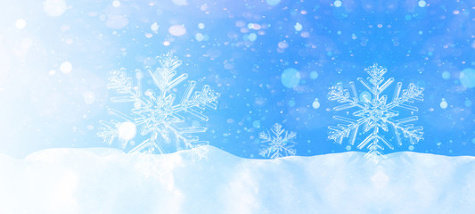 Fototapeta na wymiar snowflakes and ice crystals isolated snow with blue sky - winter background panorama banner long 