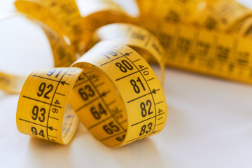 Measuring tape yellow, selective focus