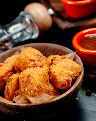 chicken nuggets with barbecue sauce on the table