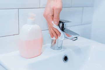 Cleaning to privent coronavirus. Clean and disinfect high-touch household surfaces: tables, light switches, remotes, handles, desks, toilets, sinks.