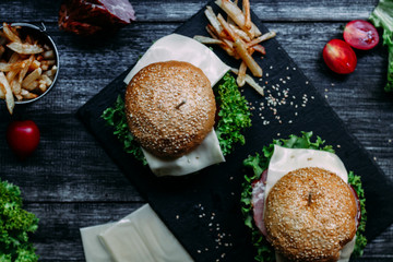 homemade burger on a dark table