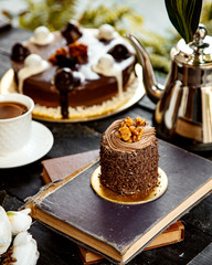 chocolate cake on top of pile of books