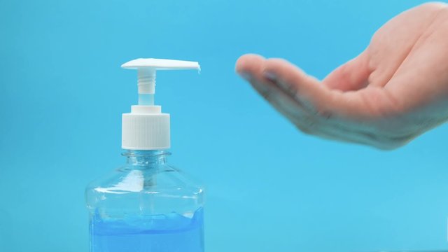 Hand sanitizer alcohol gel rub clean hands hygiene prevention of coronavirus virus outbreak. Using bottle of antibacterial sanitiser soap.
