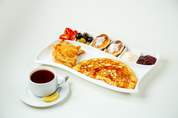 crepes with appetizers and a cup of tea