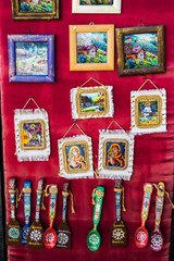 Unique traditional romanian gifts, paintings, spoons and palettes with different symbols.