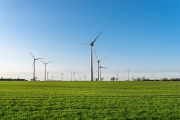 Fototapeta na wymiar Wind turbines for the production of electricity from wind in a field in western Germany.