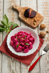 pasta with beet pesto nuts and basil