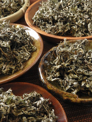 Fototapeta premium High angle view of dry mugwort on plate. Be used to ward off evil spirits and to drive away mosquitoes during the Dragon Boat Festival in Taiwan. Chinese herbal medicine.