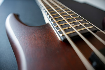Brown four string bass guitar  picture in shallow depth of field