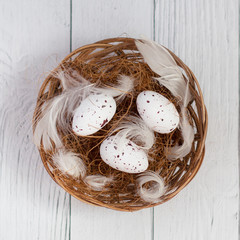 quail eggs in a straw basket
