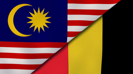 The flags of Malaysia and Belgium. News, reportage, business background. 3d illustration