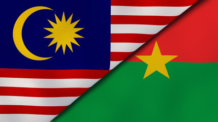 The flags of Malaysia and Burkina Faso. News, reportage, business background. 3d illustration