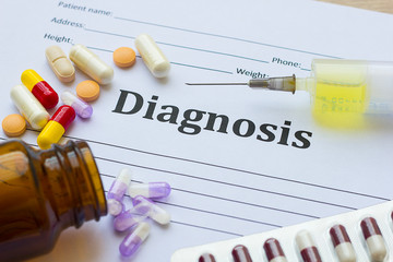 Diagnosis on white paper with medication injection, syringe and pills background copy space for...