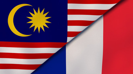 The flags of Malaysia and France. News, reportage, business background. 3d illustration