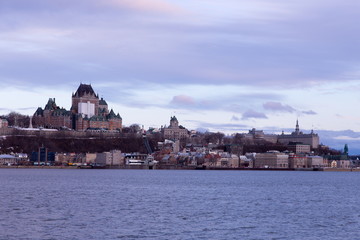 Beautiful blue hour morning view of the old town skyline seen across the St. Lawrence River from...