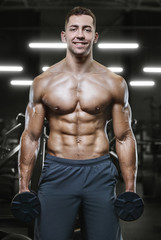 Fototapeta na wymiar Bodybuilder athletic man workout muscles exercise
