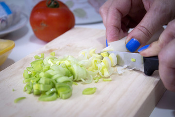 Sliced leek on a wooden cutting board
