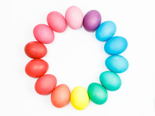 Easter multicolor eggs isolated on a white background. Rainbow. Copy space. Flat lay. Top view.