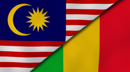 The flags of Malaysia and Mali. News, reportage, business background. 3d illustration