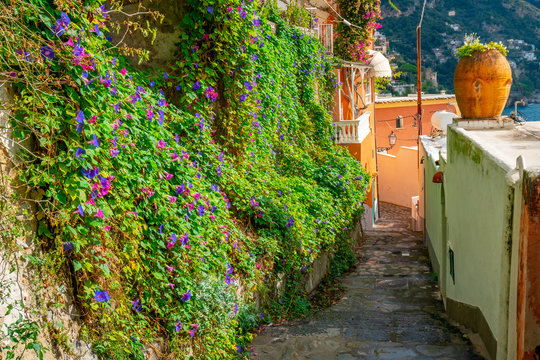 Typical narrow street and colorful houses in city of Positano