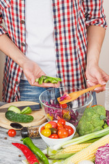 Woman cooks at the kitchen, body part, blurred background