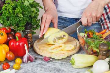Woman cooks at the kitchen, body part, blurred background