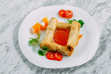 pancakes with meat and spicy sauce on a marble table