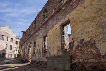 an old red brick building destroyed by time
