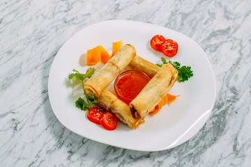 pancakes with meat and spicy sauce on a marble table