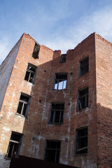 an old red brick building destroyed by time