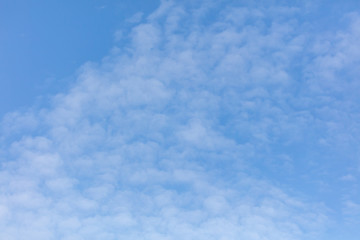 White clouds on a blue sky as background
