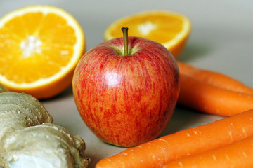 apple, oranges, carrots and ginger