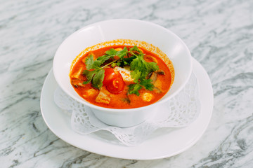 vietnamese spicy tom yam soup on a marble table