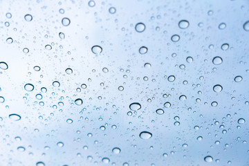 Fototapeta na wymiar Rainwater on the windshield, background concept.