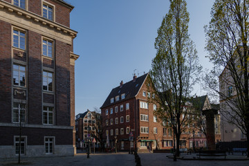 Obraz premium Empty street with closing shop, cafe and restaurant during quarantine from contagion of COVID-19 on walking street and plaza in old town in Düsseldorf, Germany.
