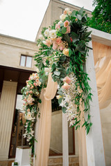 Wedding registration arch decorated with flowers
