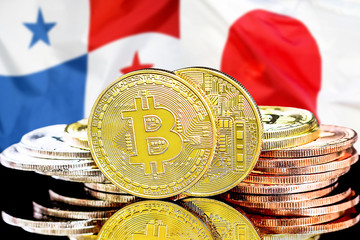 Bitcoins on Panama and Japan flag background. Concept for investors in cryptocurrency and Blockchain technology in the Panama and Japan.