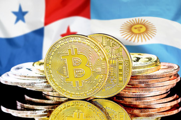 Bitcoins on Panama and Argentina flag background. Concept for investors in cryptocurrency and Blockchain technology in the Panama and Argentina.