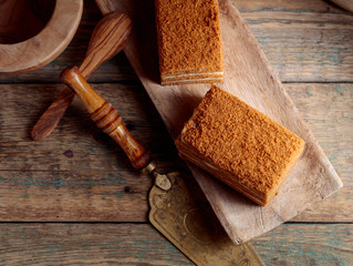 Homemade honey cake  on a old wooden table.