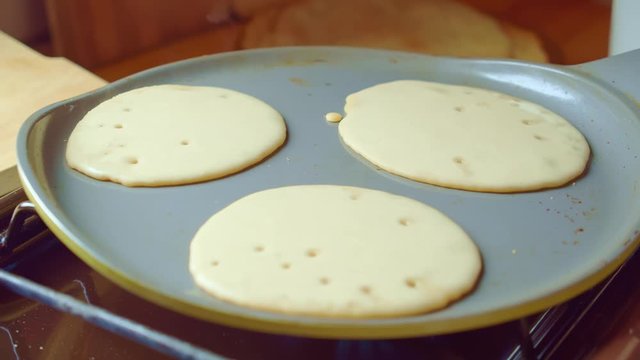 Three flapjack, tortilla bake fry pancake in pan. Steam is coming. Close up.
