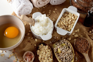 raw egg, shea butter, linseed, oatmeal, salt, sunflower seeds for the production of homemade cosmetics