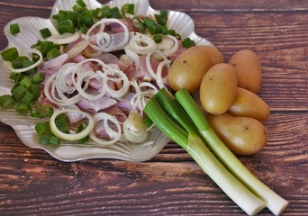 herring fillet with onions and boiled spring potatoes
