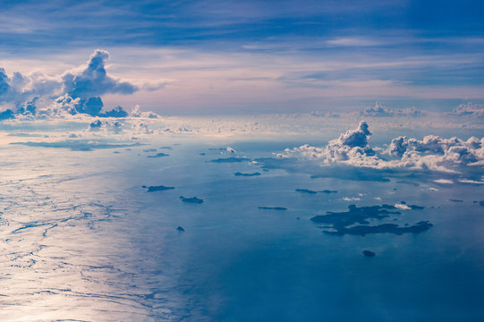 Fototapeta Seascape with some islands seen from a plane window in Philippines