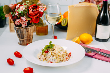 fettuccine pasta with red tomato fish and cheese
