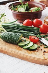 Dietary food background: vegetable salad with cherry tomatoes and cucumbers, vegan cuisine