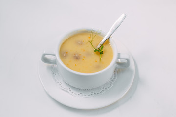 homemade cheese soup with meatballs isolated on a white background
