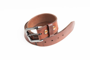 A formal studio product shot of a men’s used brown leather belt with patina set on plain white background.