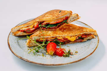 triangular meat and tomato sandwiches