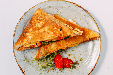 triangular meat and tomato sandwiches