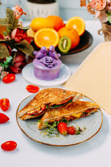 triangular meat and tomato sandwiches
